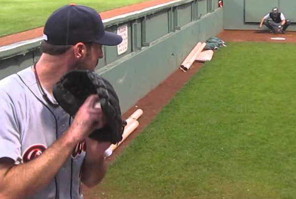 Just Verlander in Tigers jersey in bullpen throwing a pitch to catcher that is in background