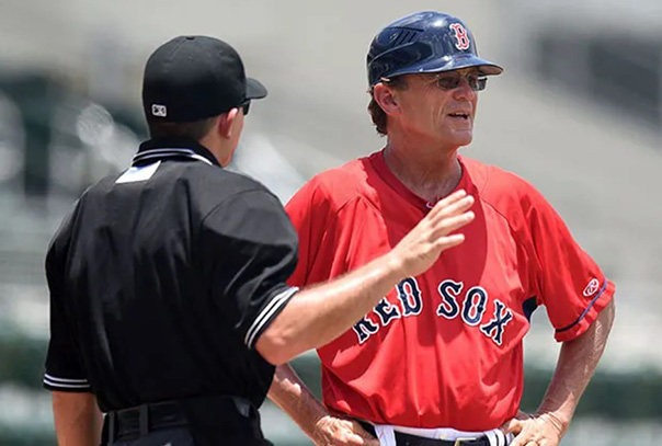 Boston Red Sox coach talking to an umpire