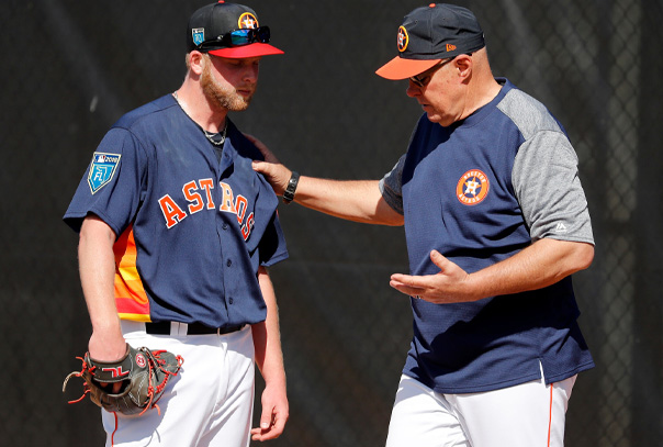 Houston Astros Pitching coach talking to a pitcher