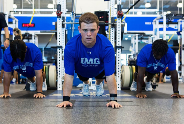 Three IMG players in the weight room