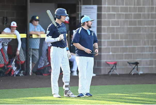 Ehrich Chick on deck with one of his players.