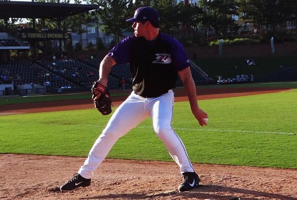 Left-handed pitcher on the mound