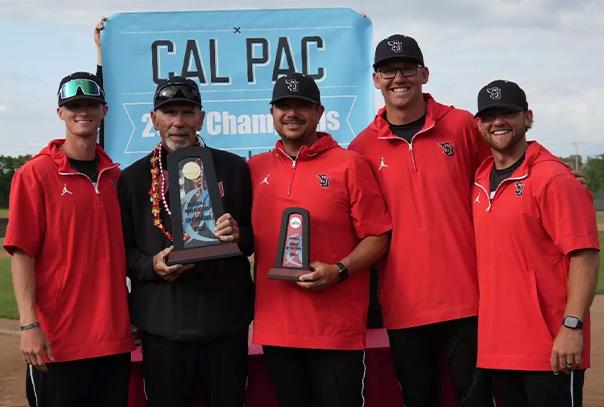 Simpson University Coaching Staff holding Cal Pac trophies