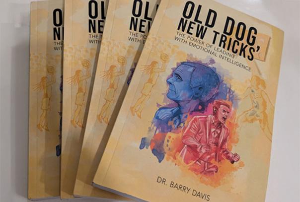 Barry Davis' Old Dog, New Tricks books laid out on a counter