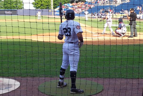 On deck hitter looking at pitcher