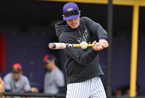 Mike LaRosa hitting a fungo